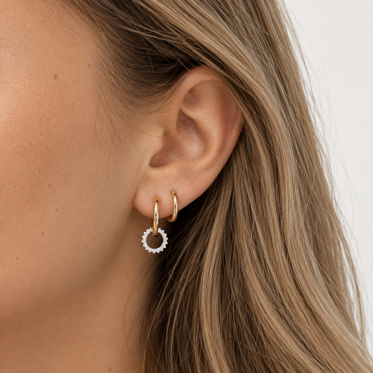 gold hoop with silver hoop charm